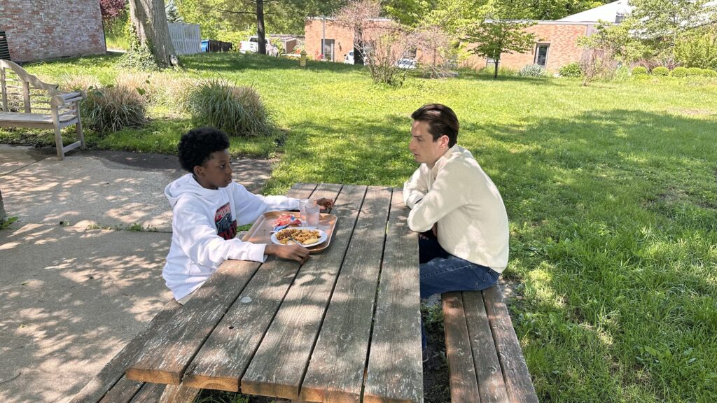 David Maia visits with alumni at Saint Louis Priory School