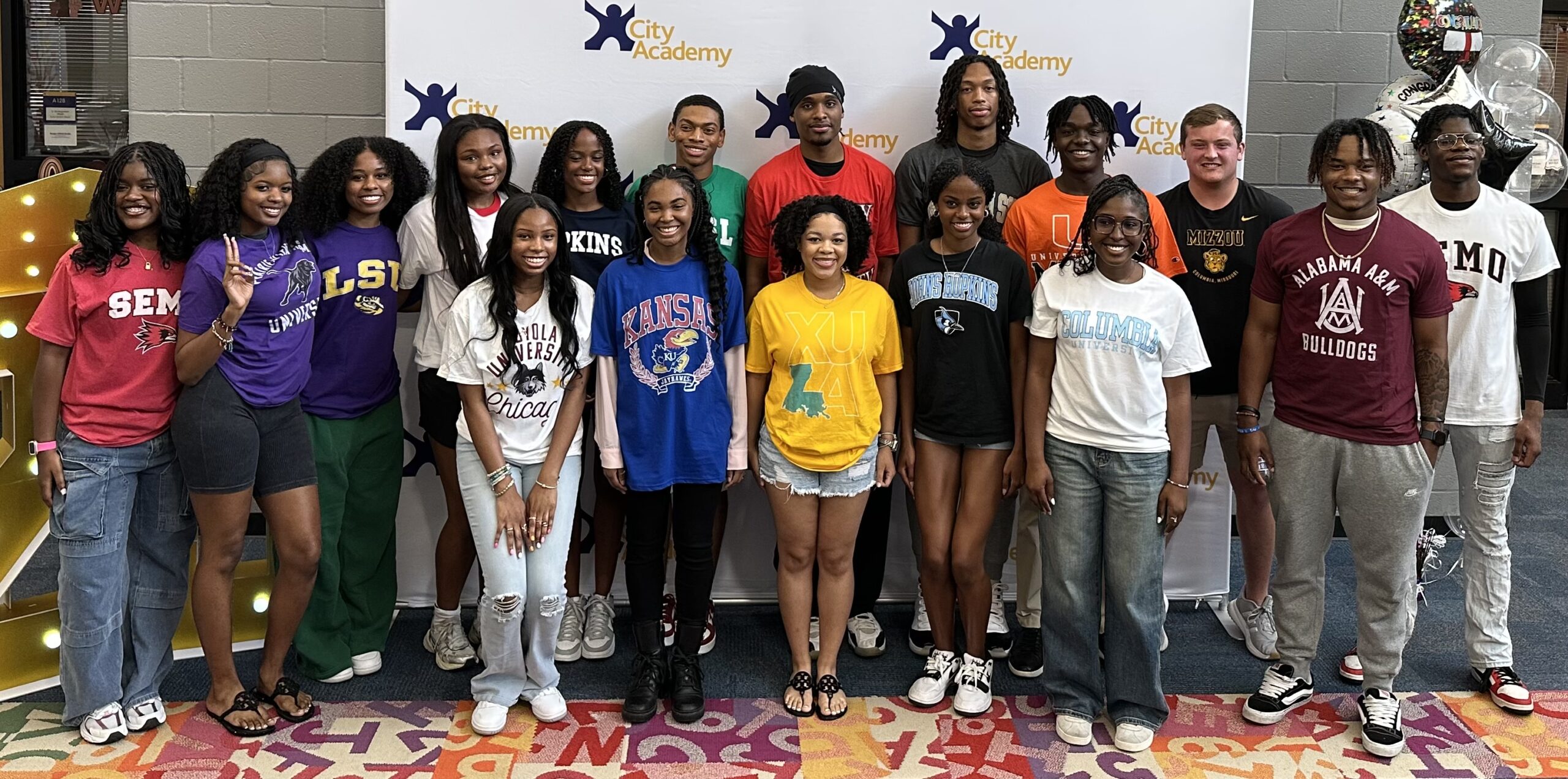Class of 2019 in college shirts
